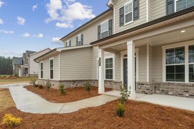 Entrance to property featuring brick siding