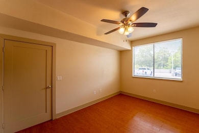 Unfurnished room with wood finished floors, ceili