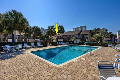 Community pool featuring a patio area and fence