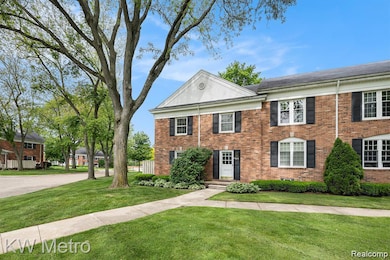 View of front of home featuring brick siding and a front yard