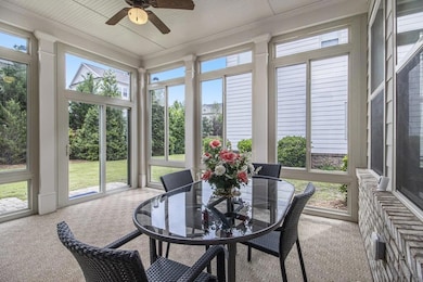 Step outside to a Private Screened-In Porch that's ideal for Year-Round Relaxation and Dining.