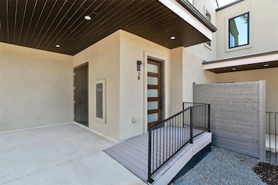 View of exterior entry featuring stucco siding an