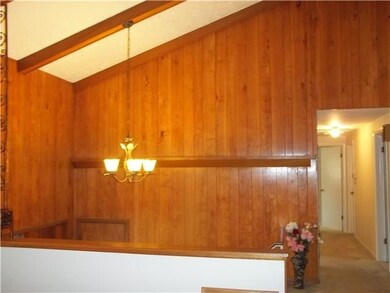 Foyer. Upper part of foyer with hall to bedroom ar