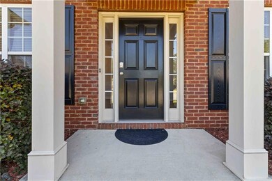 Entrance to property featuring brick siding and co