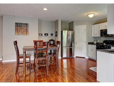 This lovely eat-in kitchen offers newly painted ca