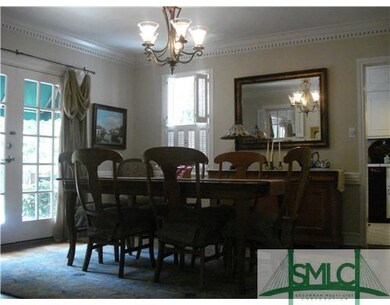 Dining Room. Lovely patio with awning outside Fren