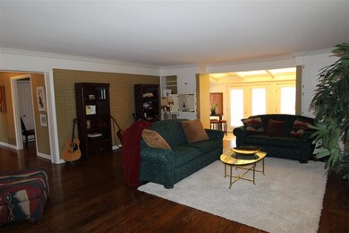 The living room features a beautiful fireplace and