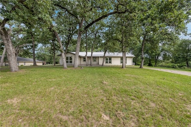 View of front facade with an attached garage, a fr