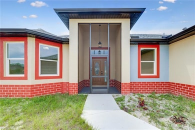 Property entrance with stucco siding