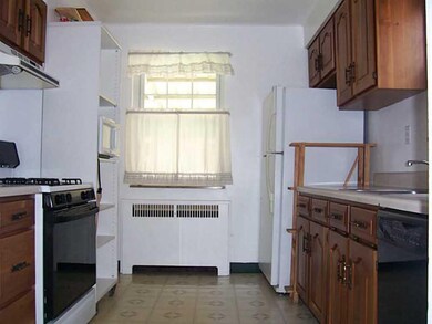 Kitchen. View towards the backyard window; good co