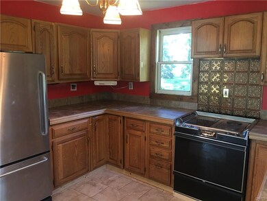 Kitchen with new counter tops and tile floors.