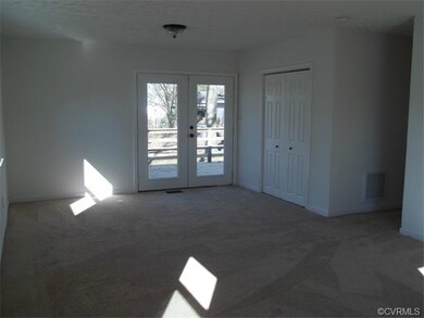French doors in the master suite lead to the deck