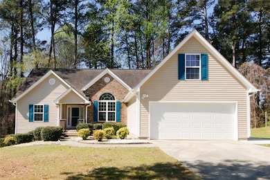 View of front of property with a garage and a fron