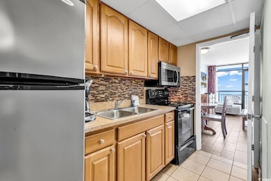 Kitchen featuring stainless steel appliances, ligh