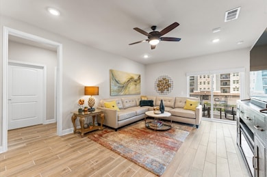 Spacious open-concept living area with abundant na