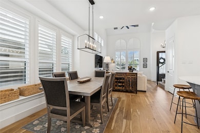 Dining room featuring light wood-style flooring, recessed lighting, and a chandelier