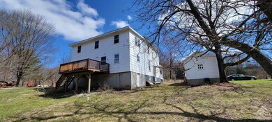 View of house with detached garage