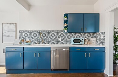 The updated eat-in kitchen is bathed in light and 