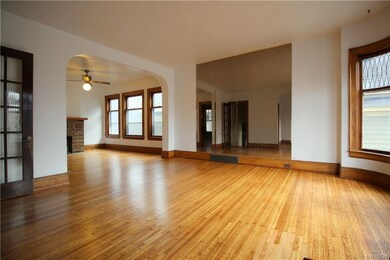 Second floor living room flows into dining room wi