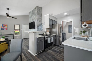 Kitchen featuring lofted ceiling, stainless steel 