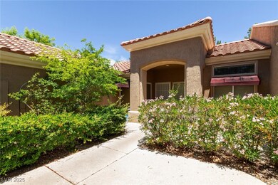 Doorway to property with a tile roof and stucco si