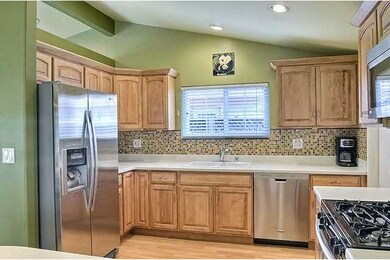 The kitchen features Corian countertops and a colo