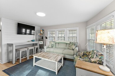 Living room with hardwood / wood-style floors and 
