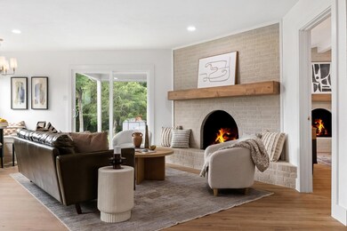 Living room featuring an inviting chandelier, hard