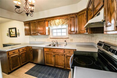 A spacious kitchen with updated dishwasher and sto