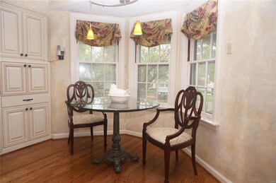 Breakfast room area with bay windows.