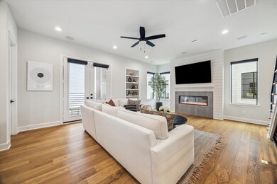 A living space with beautiful hardwood floors, a l