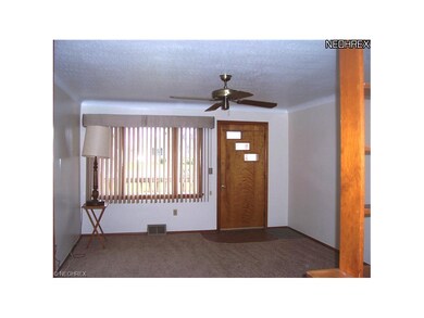 Living room with brand new carpet and paint.