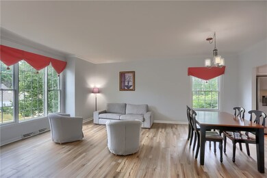 An expansive living room and dining area combination room is ready for your next gathering.