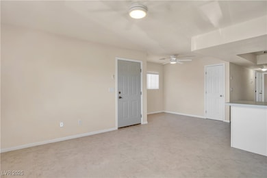 Unfurnished room with baseboards and ceiling fan