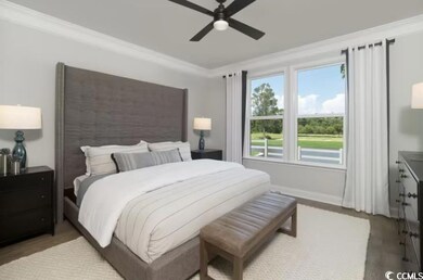 Bedroom with ornamental molding, ceiling fan, and baseboards