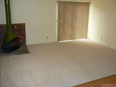 Family room with free standing fireplace.