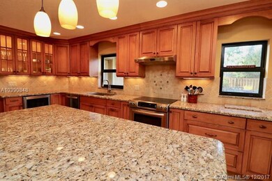 This brightly kitchen has recessed lights, under c