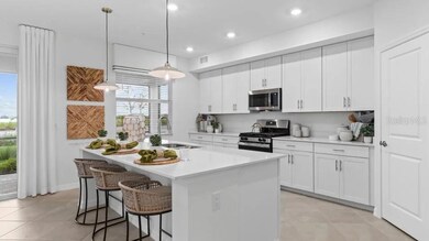 The chef-inspired kitchen showcases expansive quartz countertops and a large corner pantry, along with an oversized modern island adjacent to the lanai for sun-lit meals.