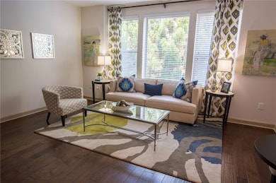 Living room featuring dark hardwood / wood-style flooring