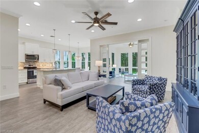 Living area featuring ceiling fan, recessed lighting, light wood-style floors, and baseboards