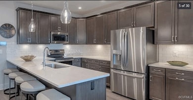 Kitchen featuring appliances with stainless steel
