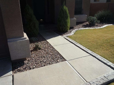 FRONT WALK WITH STAMPED CONCRETE AND PAV