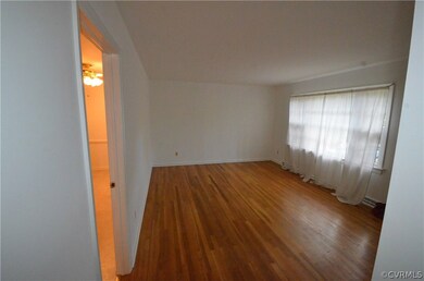 Formal living room with a picture window and a doo