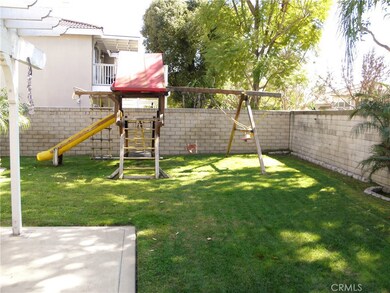 BACKYARD SHOWING PLAYSET. INCLUDED IN THE SALE.