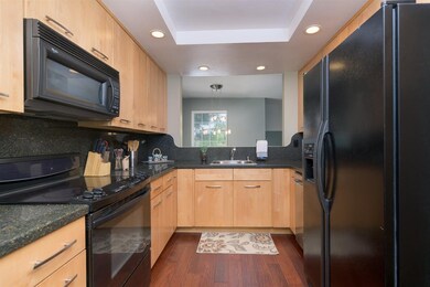 Kitchen with newer appliances and designer cabinet