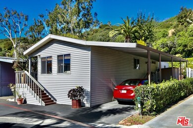 Front of house with carport
