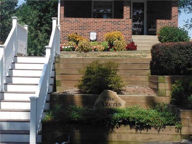 Facade/Exterior Front. Landscaped. Trex steps, vin