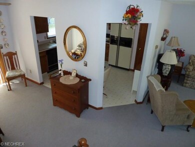 Dining room to left of photo with lighted paddle c