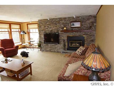 Living Room. Beautiful stone gas fireplace.