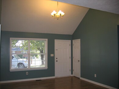 Vaulted ceilings, fresh paint, and new flooring in the living room!